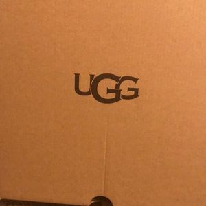 UGG silver sneakers. Size 9. Too tight for my feet. Never been worn.